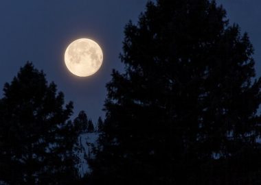 Full moon sets over ridge of Sepulcher Mountain. Original public domain image from Flickr